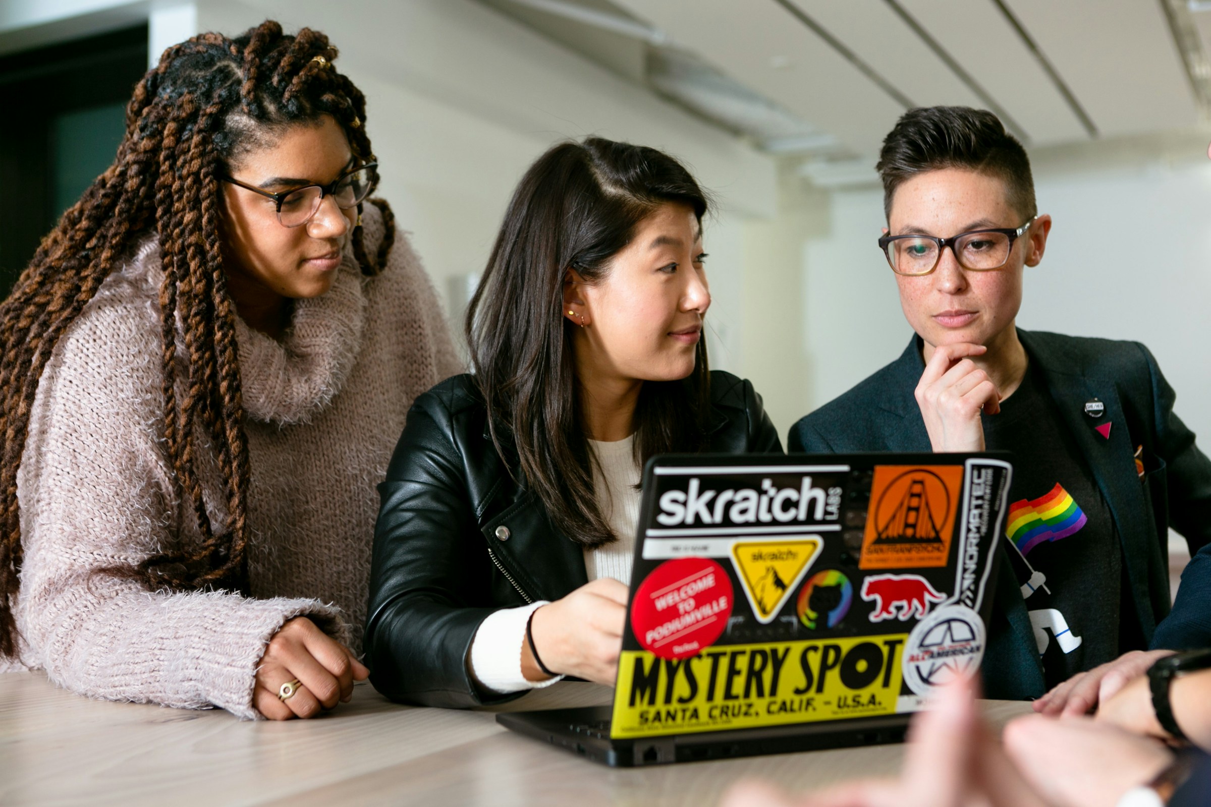 employees working on a laptop - Top Webflow Development Agency