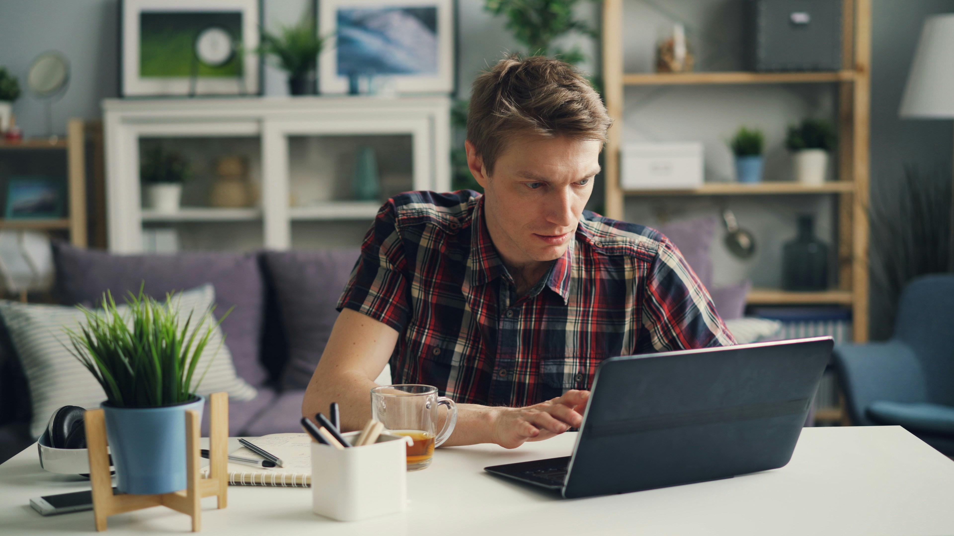 man working on a tablet - webflow forms