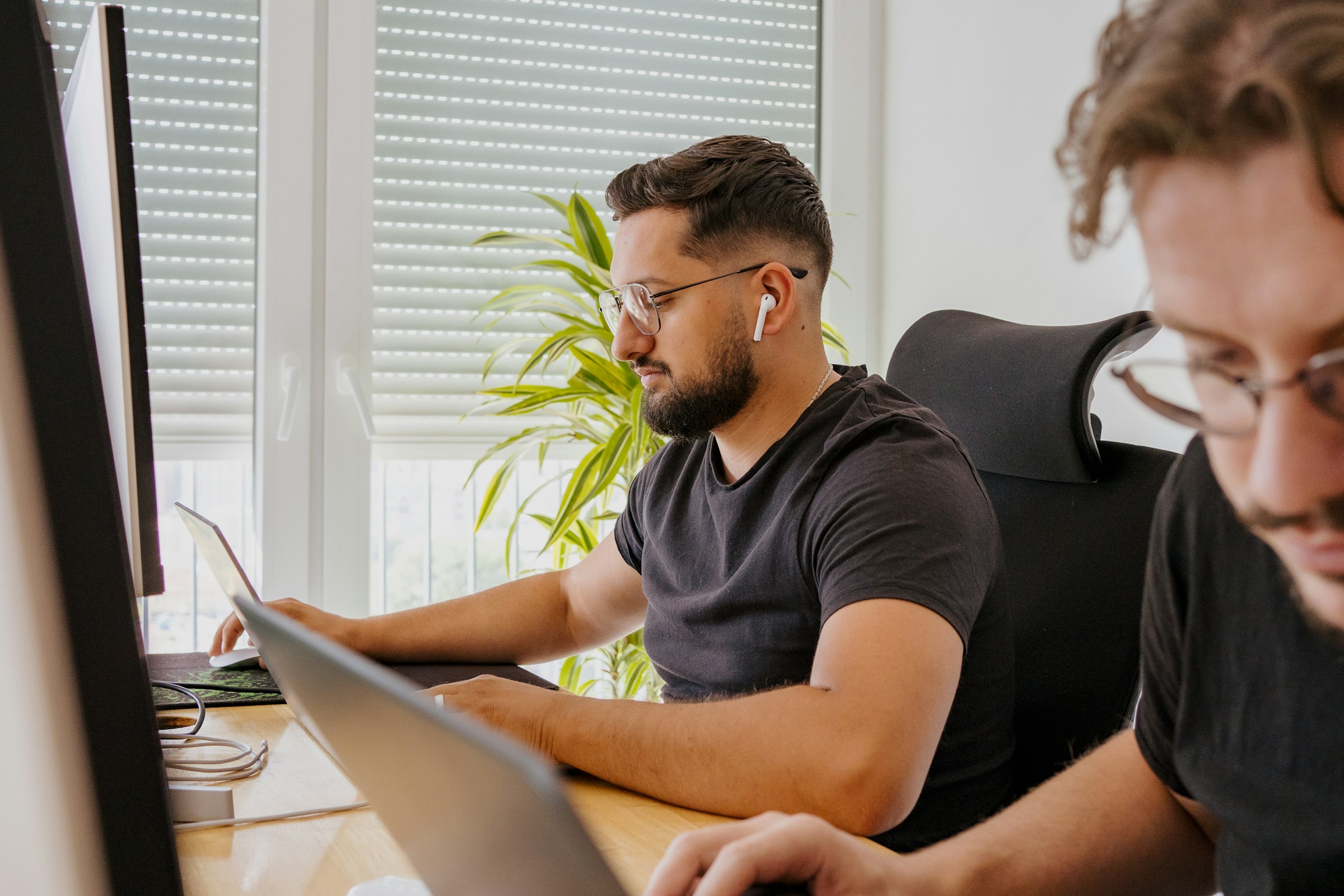 man working on a laptop - webflow forms