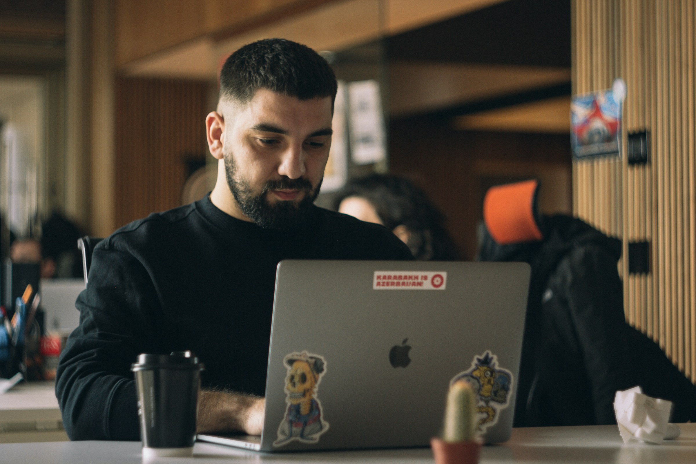 man working on a laptop - Framer CMS  