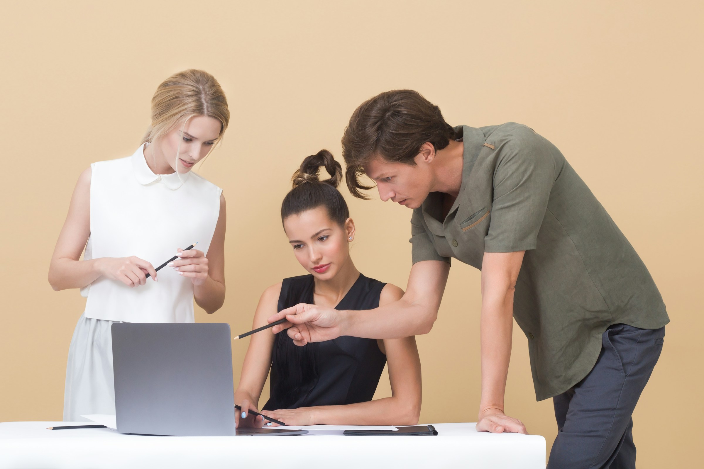 employees working on a laptop - Framer Google Sitemap Could Not Fetch