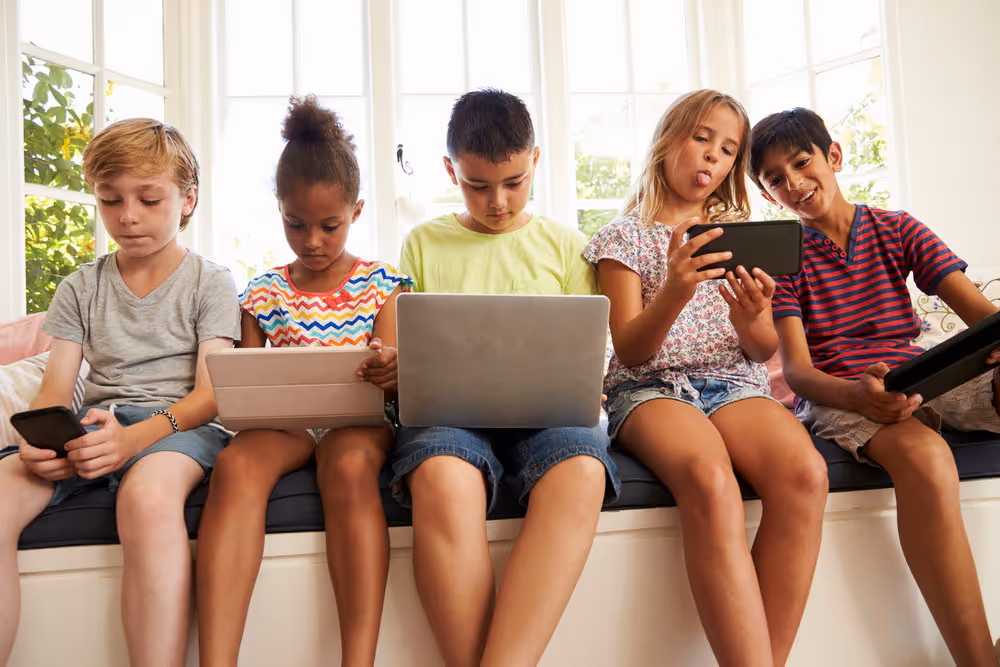 group of children with screens