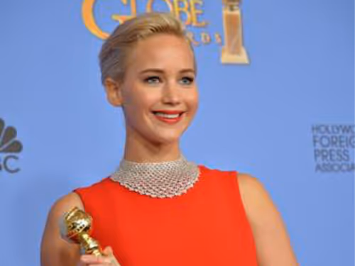 Jennifer Lawrence holding a trophy