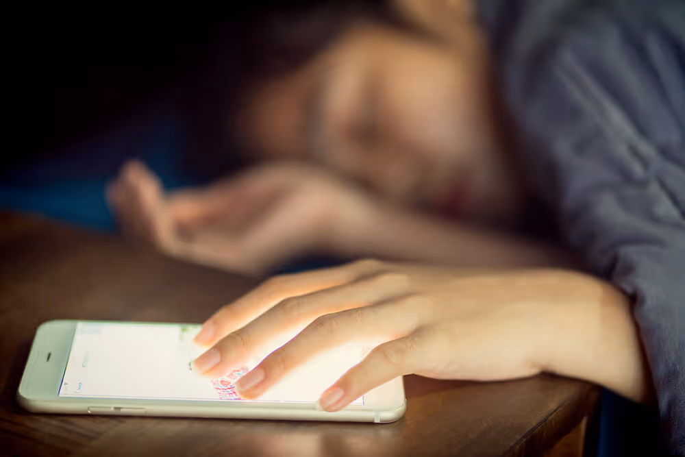 person sleeping with phone
