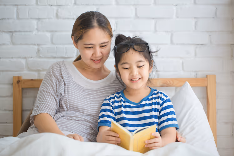 Girl and mom reading