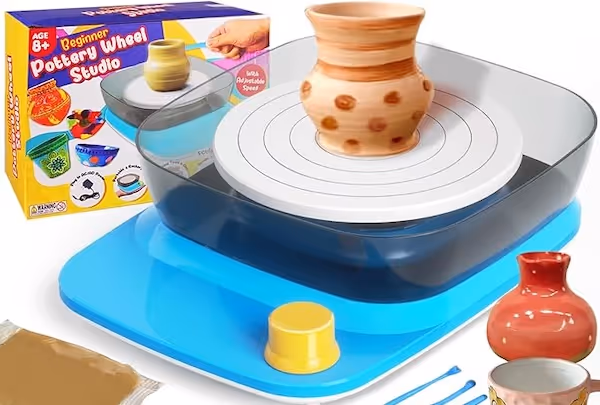 small pottery wheel, wtith orange and brown pot being spun on it.