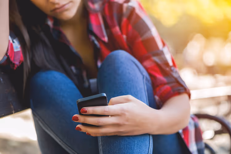 Woman with phone in hand
