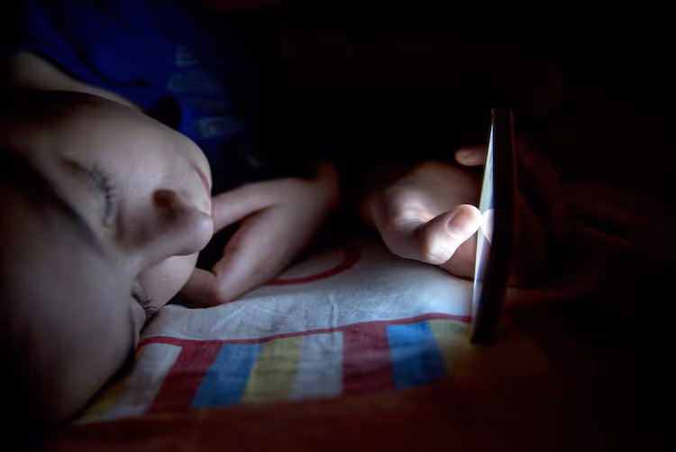 Child holding cellphone