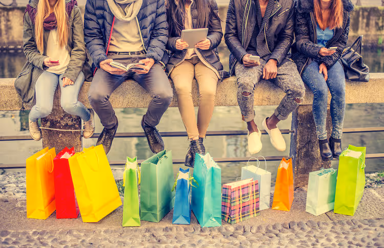 group of people sitting on wall
