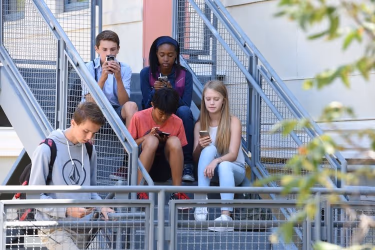 Group of teens on phones