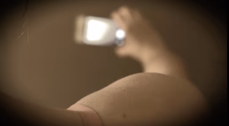 Girl holding phone taking picture of herself