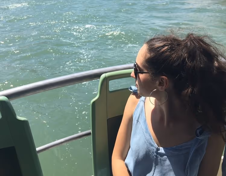 Girl on a boat looking out 