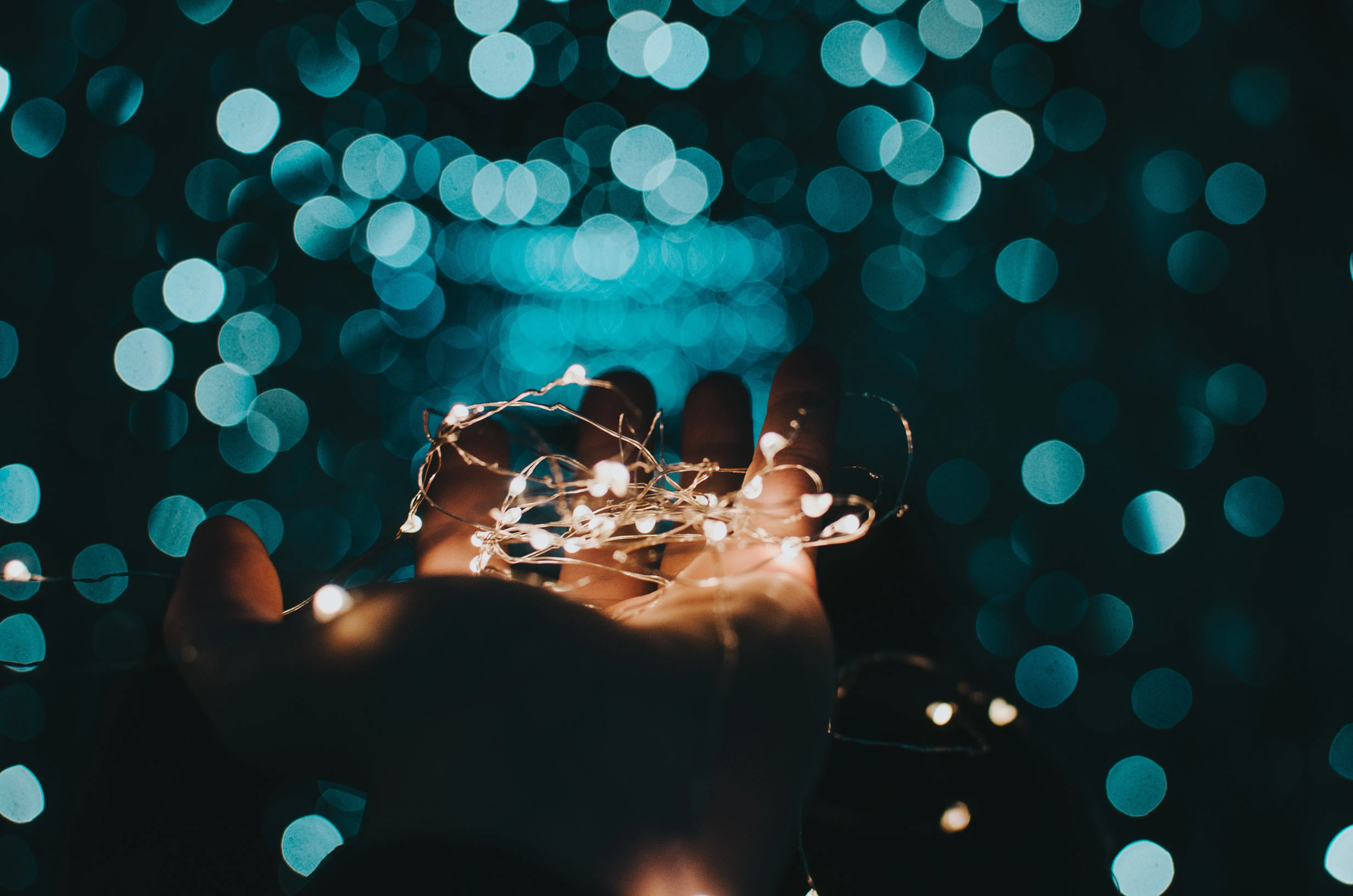 Person holding sparks in their hand