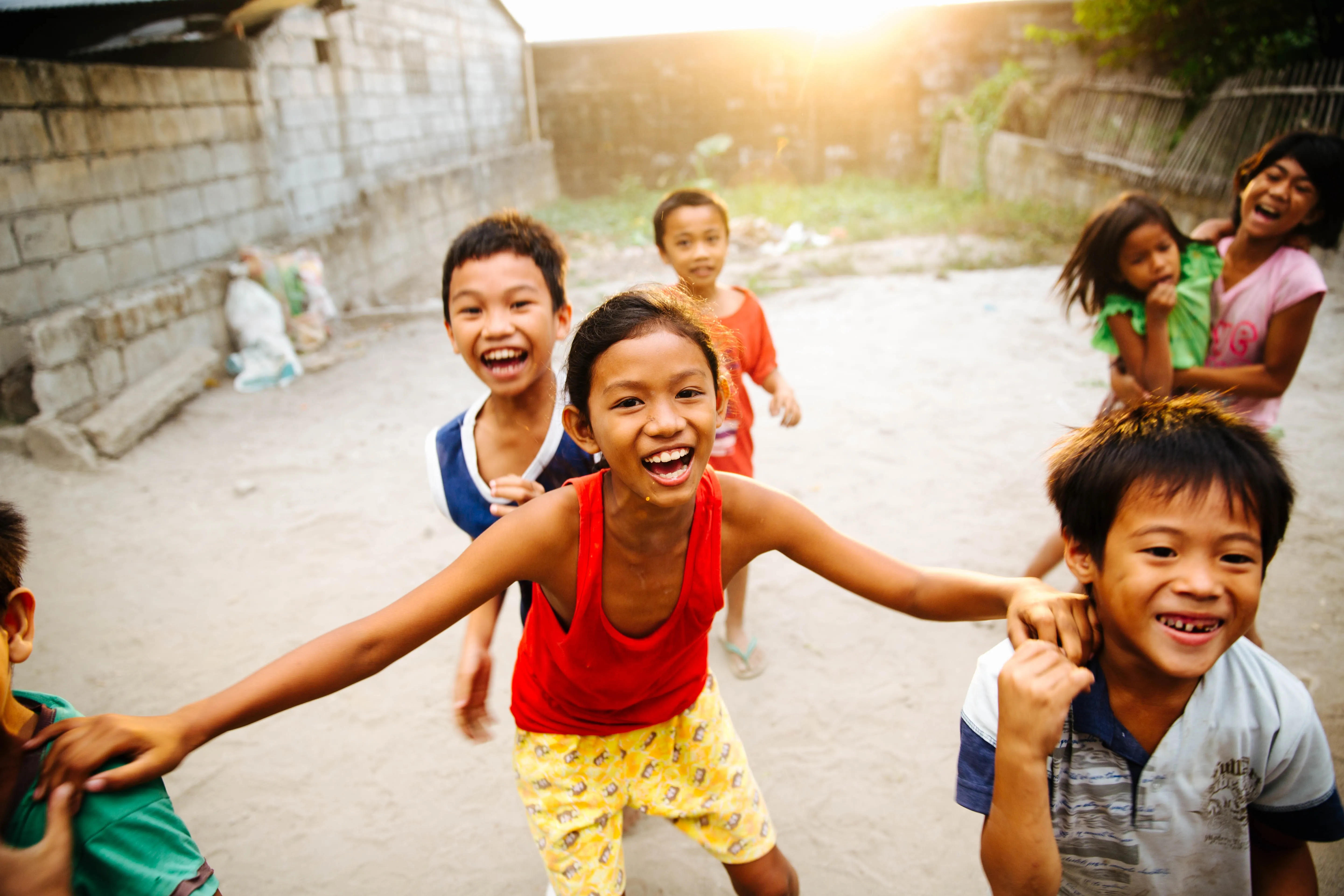 Children smiling and playing outside