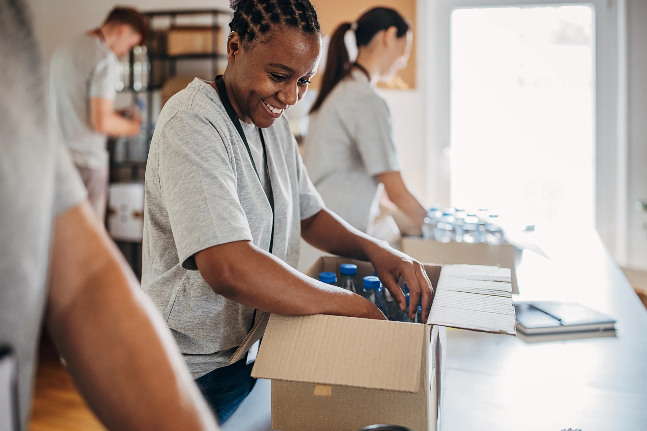 Woman packing a paper box