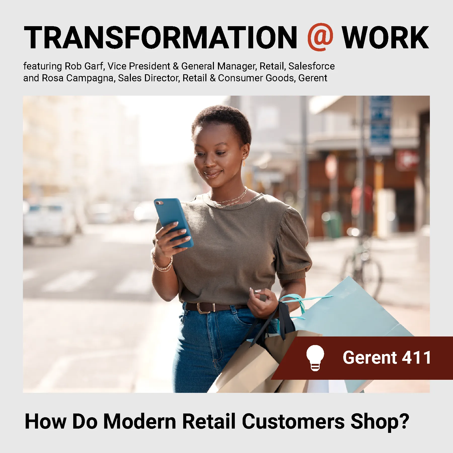 Person walking looking at a cellphone with shopping bags on her arm