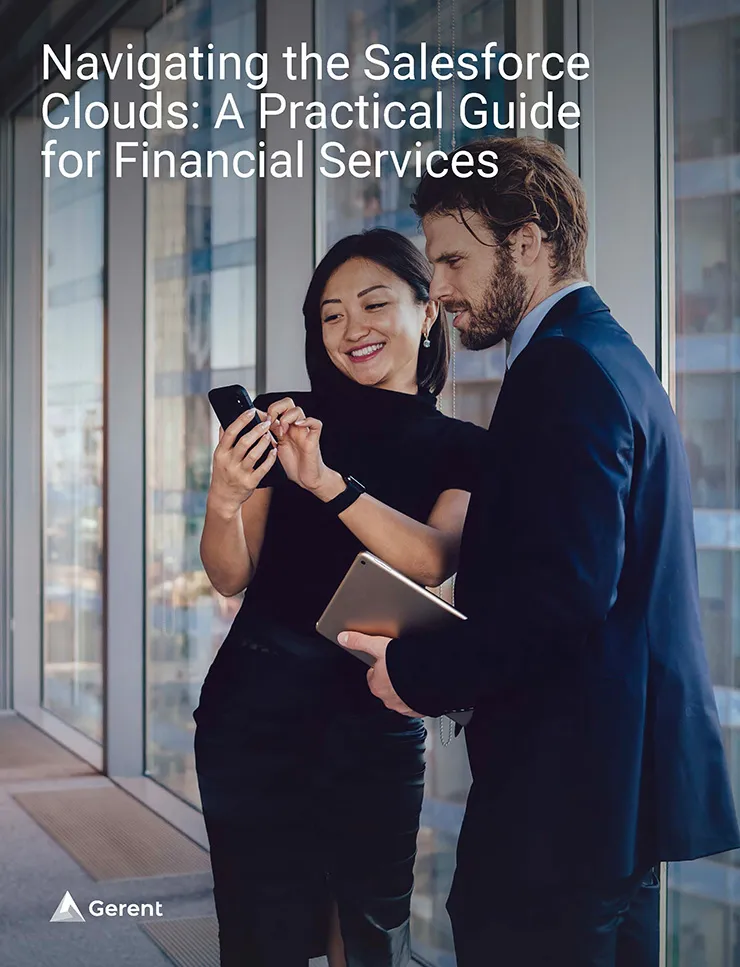 Business man and women standing next to one another looking at a cellphone the women is holding