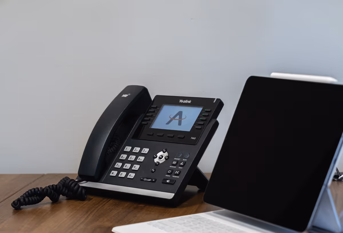 Wheaton business owner on a phone call with an IT expert planning a support strategy