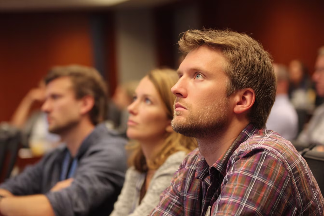 Professionals attending cyber security awareness presentation