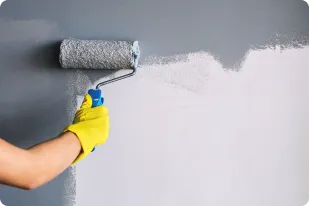Person painting wall