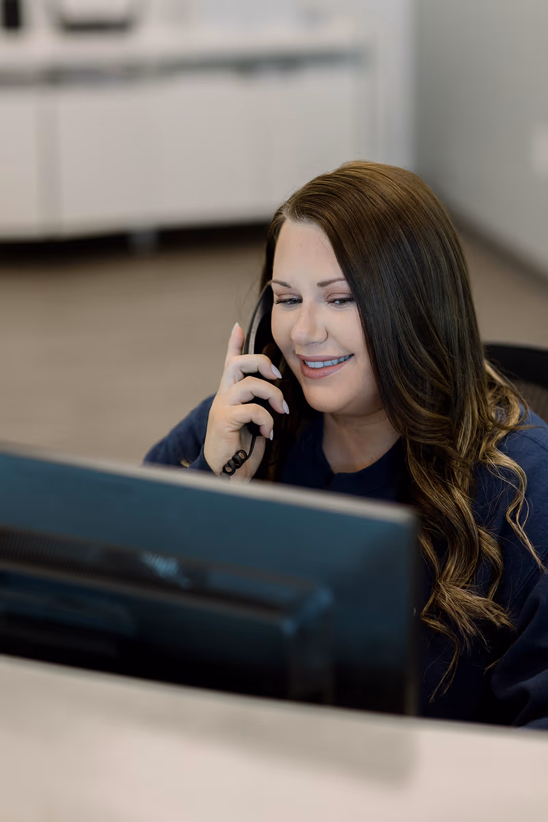 Office Coordinator at White River Endodontics answering the phone and scheduling patients for root canal therapy 