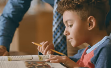 Child reading textbook