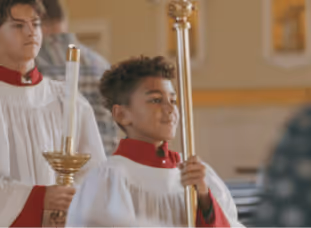 A boy serving at Mass