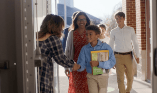 Student greeting teacher