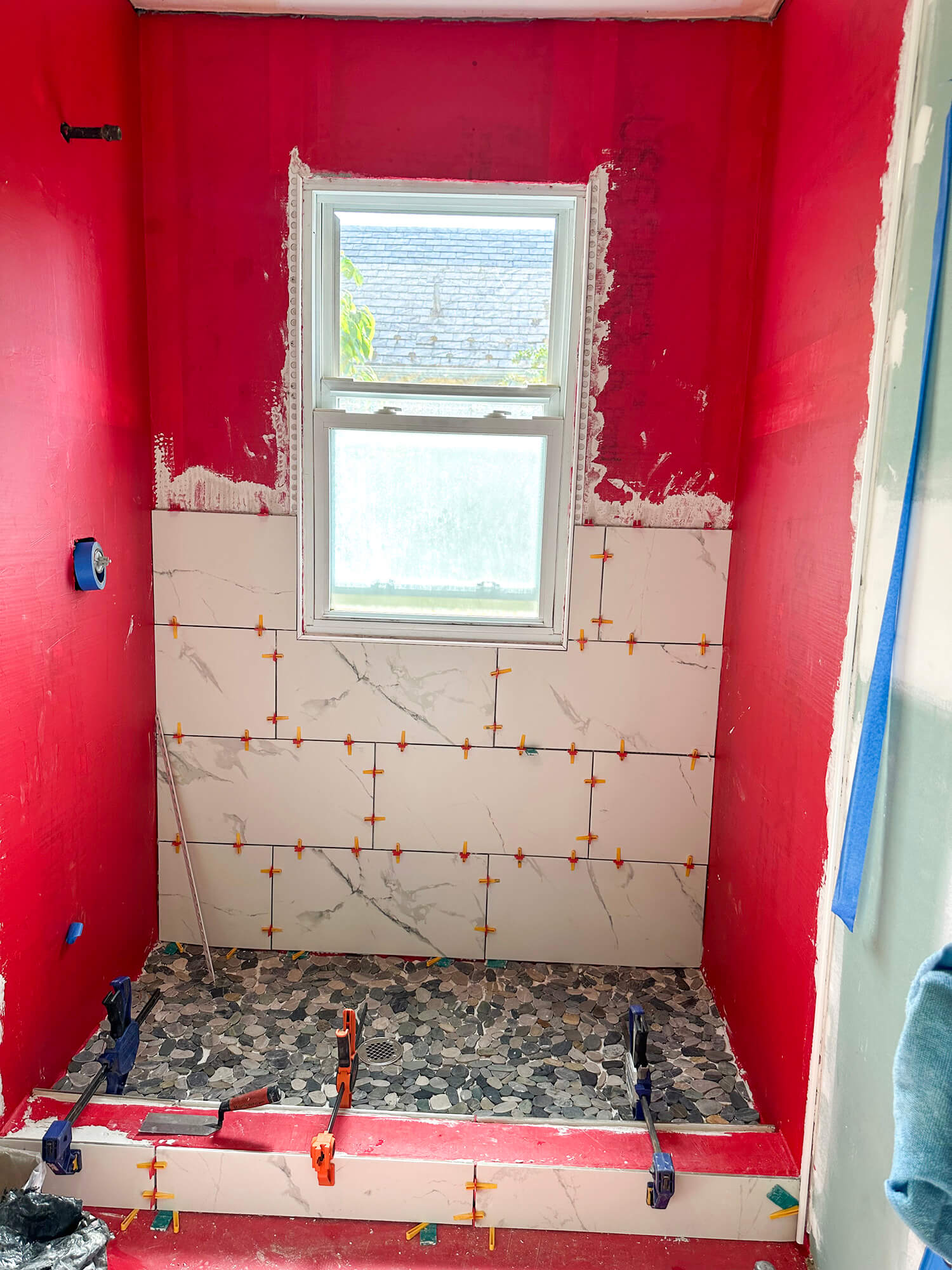 Bathroom with new floor and wall tiles installed