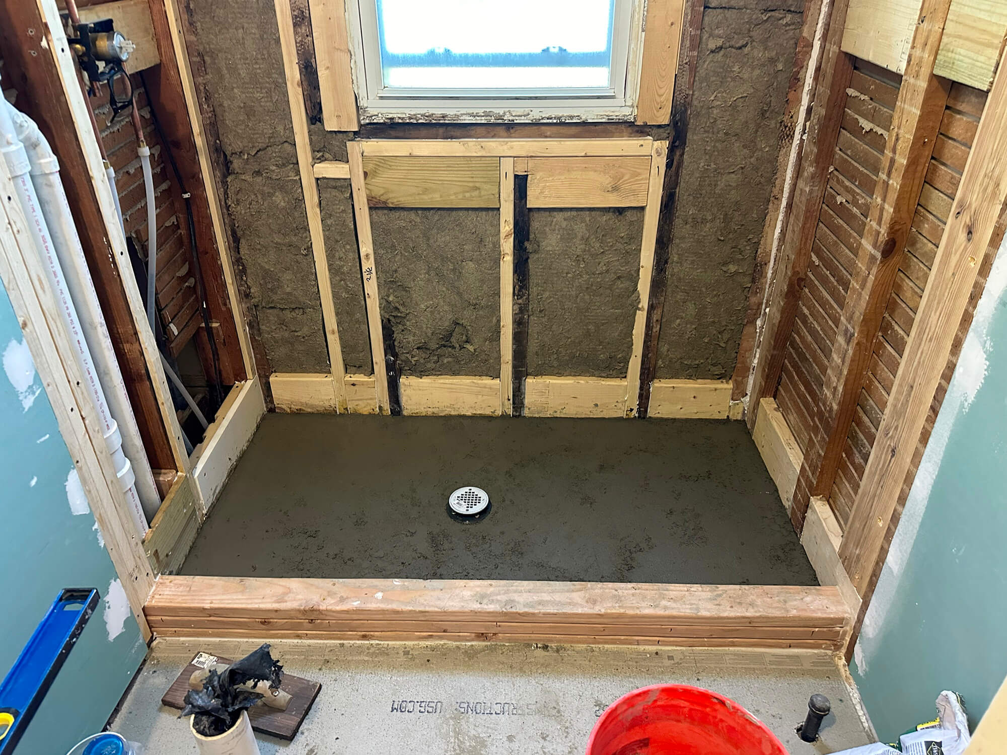Bathroom floor, walls, and bath tub patched up