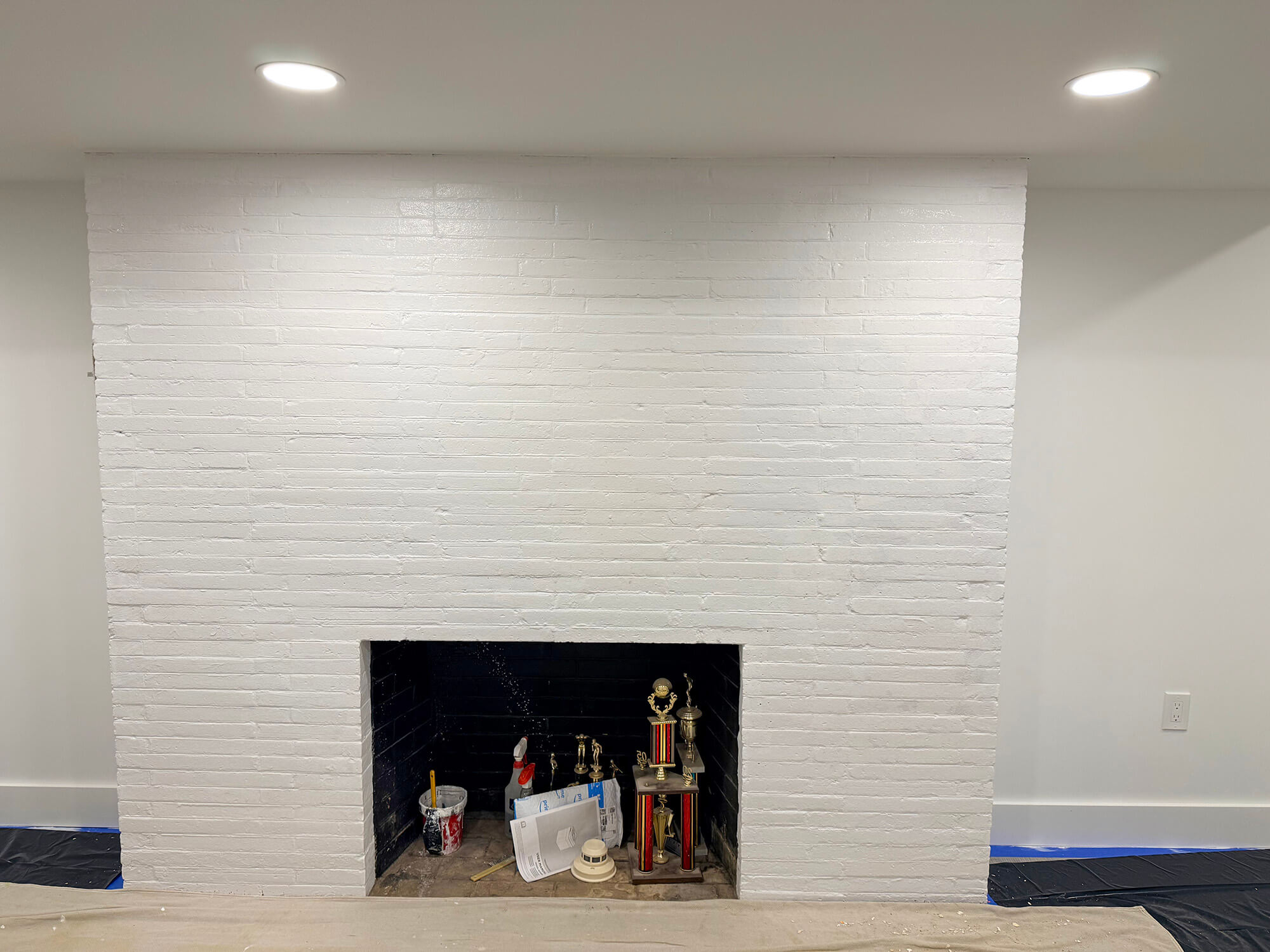 Basement fireplace brick wall painted