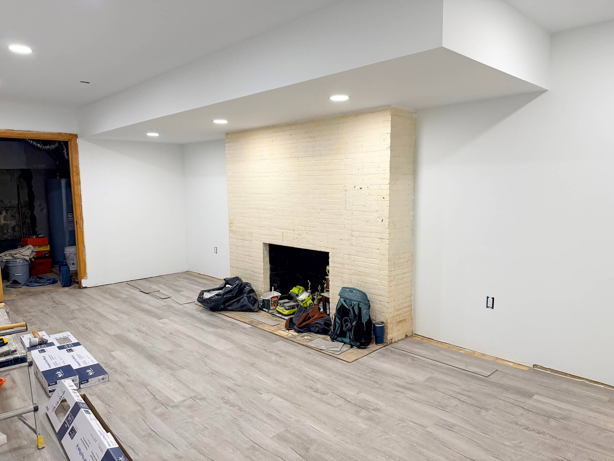 Basement wall painted and floor tiles laid out