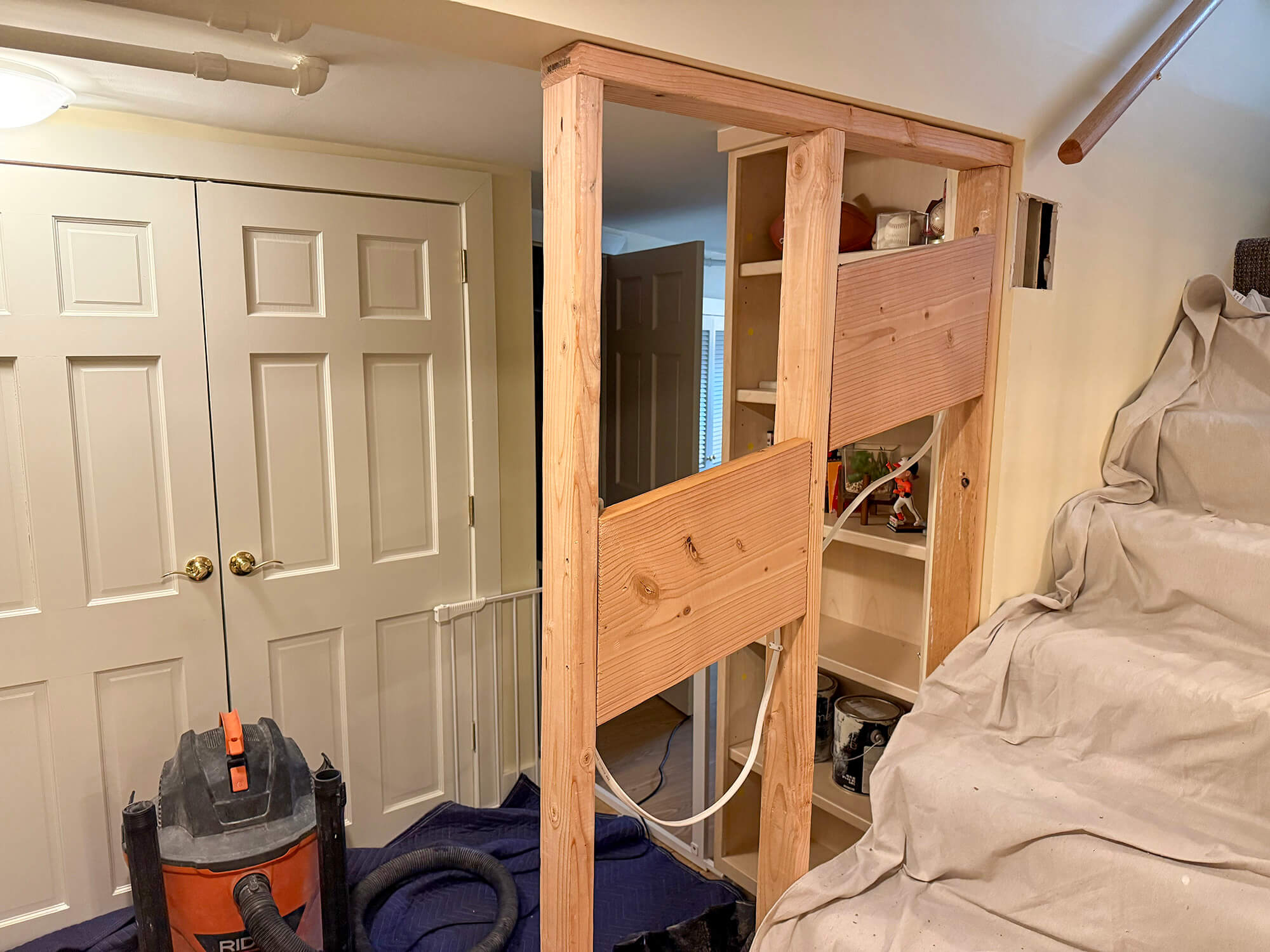 Stairs tarped up for new wood panels being installed