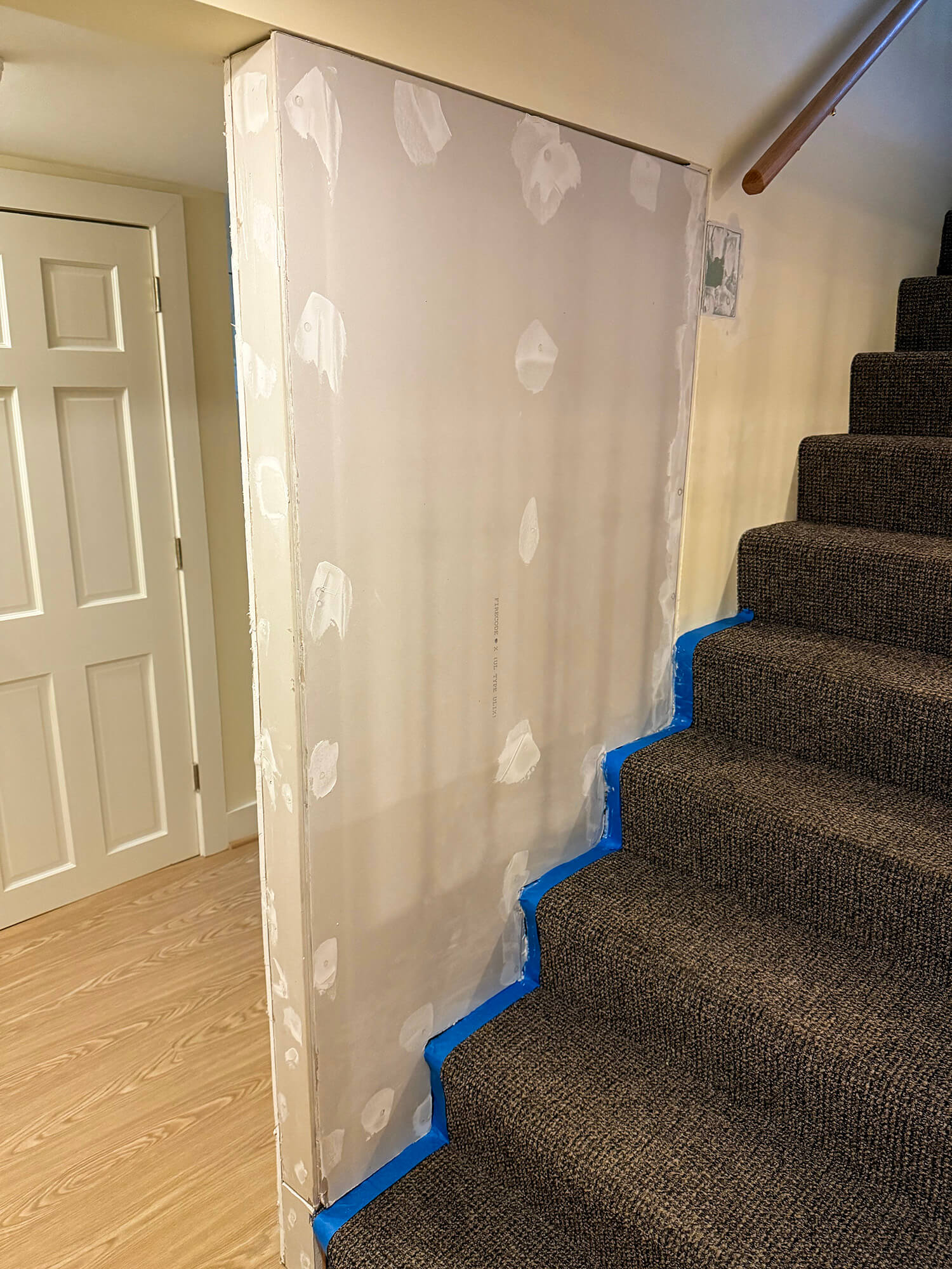 New wall installed at the bottom of stairs