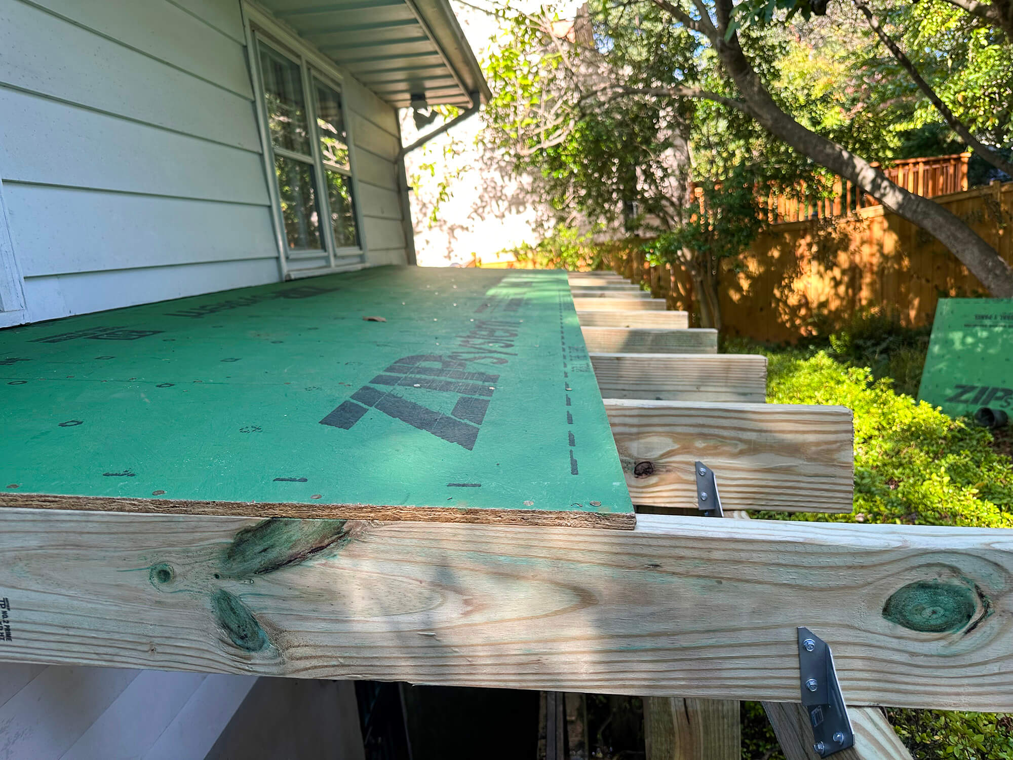 sheet of wood installed on frames