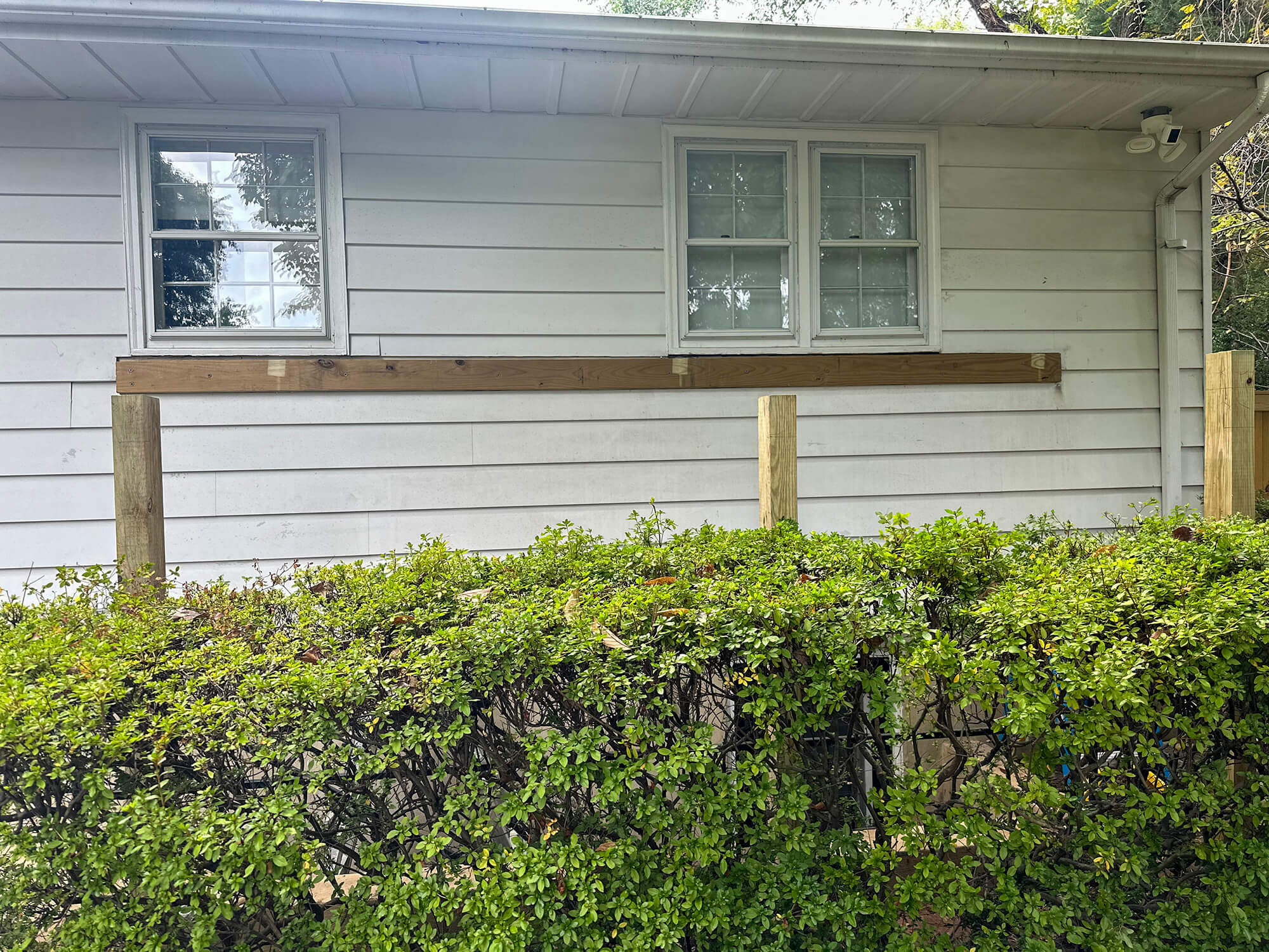 New wood beams installed on exterior of house