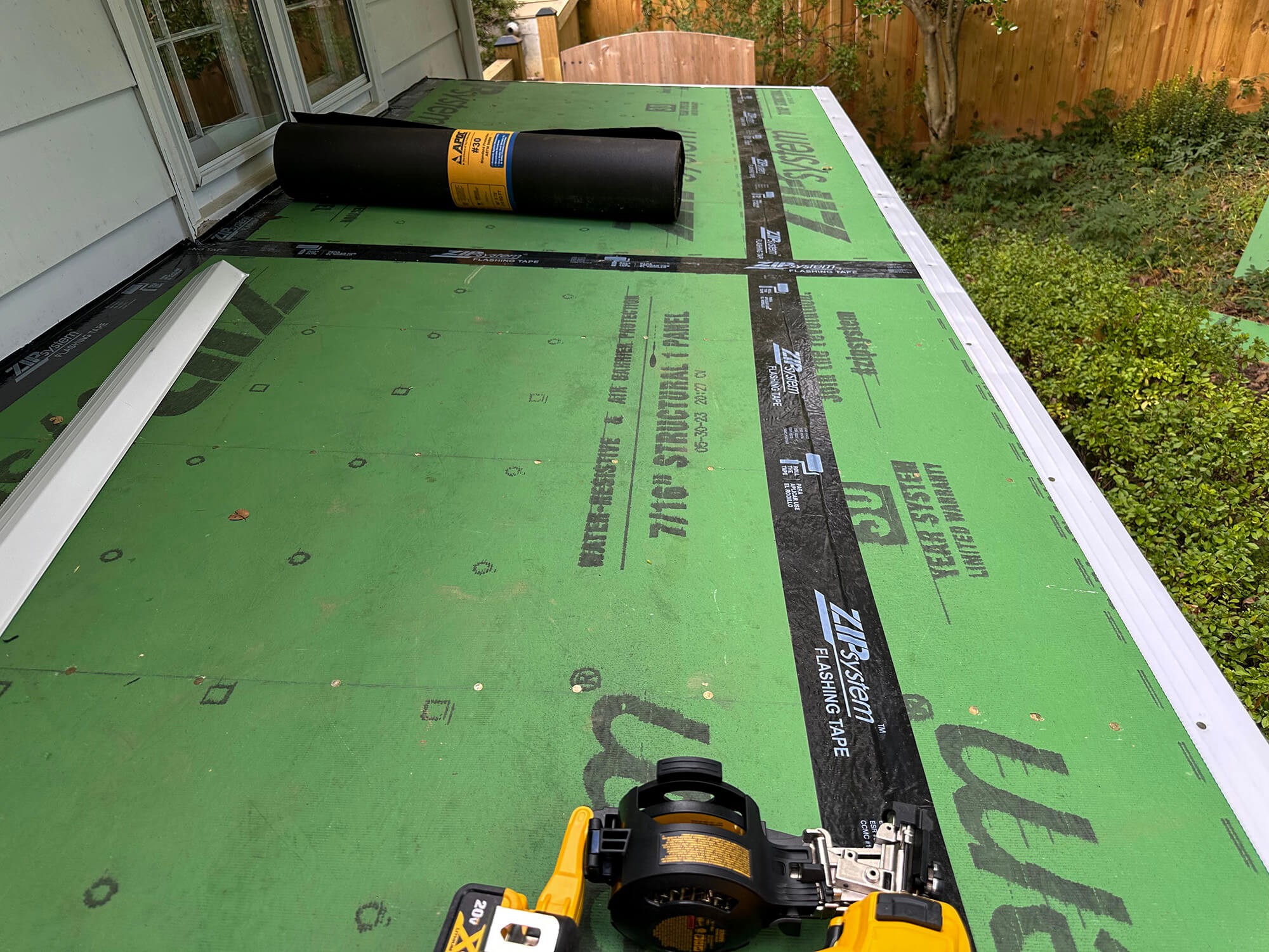 Flashing tape installed on roof wood sheet