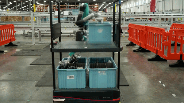 A gif shows a humanoid robot, Digit, at work at GXO’s Flowery Branch facility moving totes from rolling carts onto a conveyor belt. Physical AI applications like Digit are revolutionizing what is possible with AI and robotics.