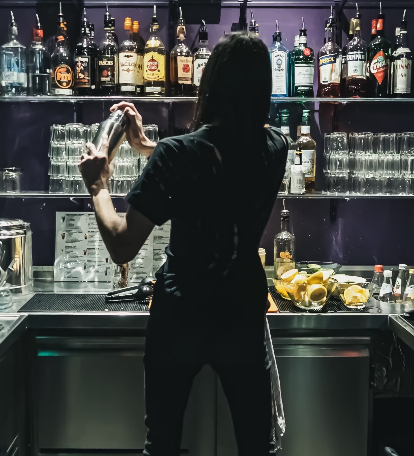 A bartender mixing a drink