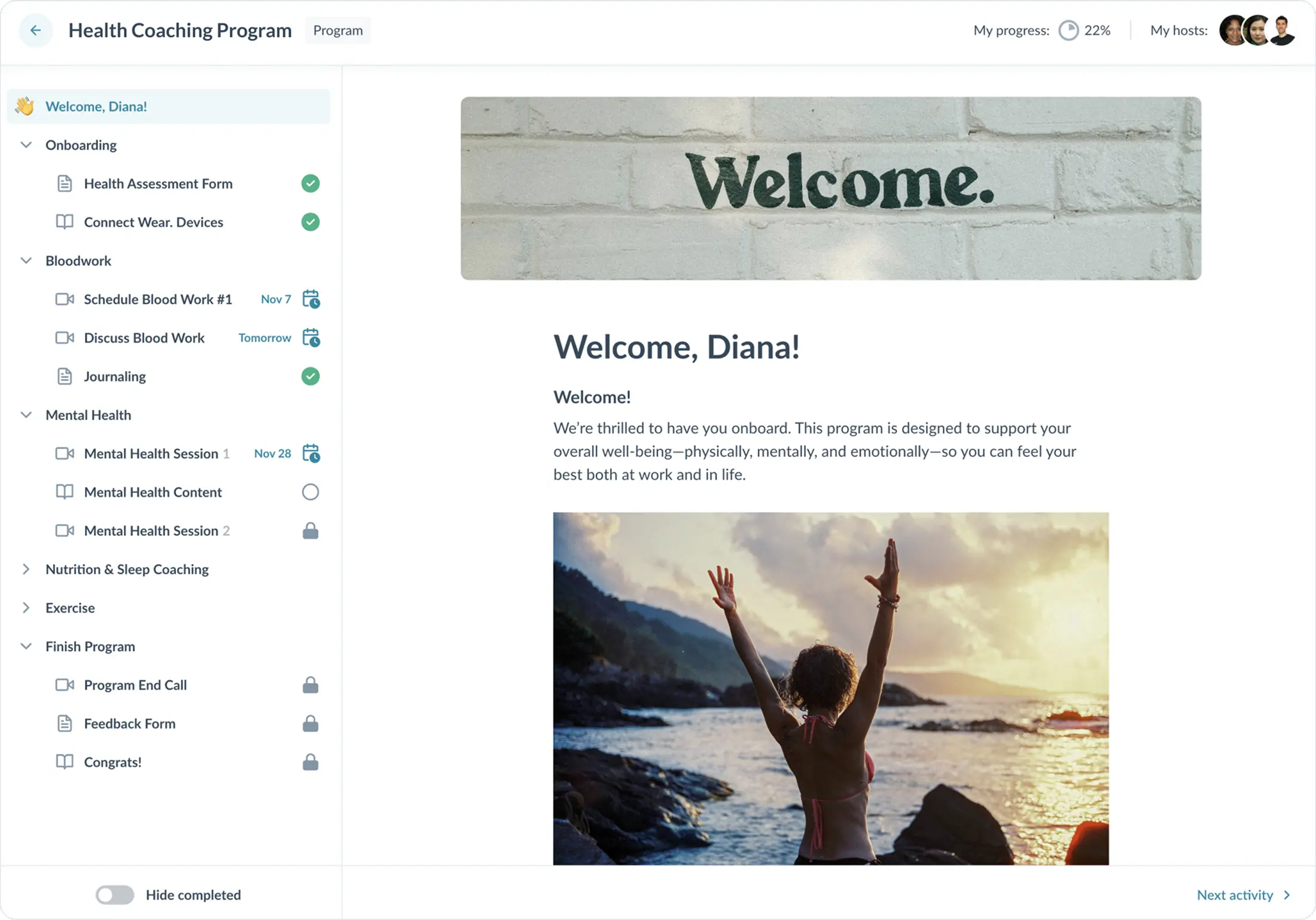 A woman stands with raised arms by the ocean, symbolizing empowerment and wellness, as part of a health coaching program overview.