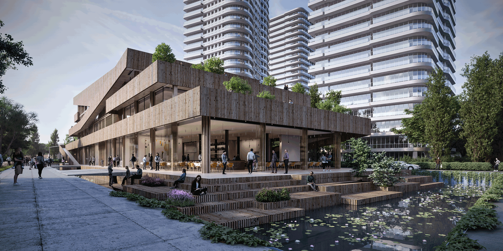 Public gathering space featuring tiered wooden seating steps next to a biological pond and the resilient timber building.
