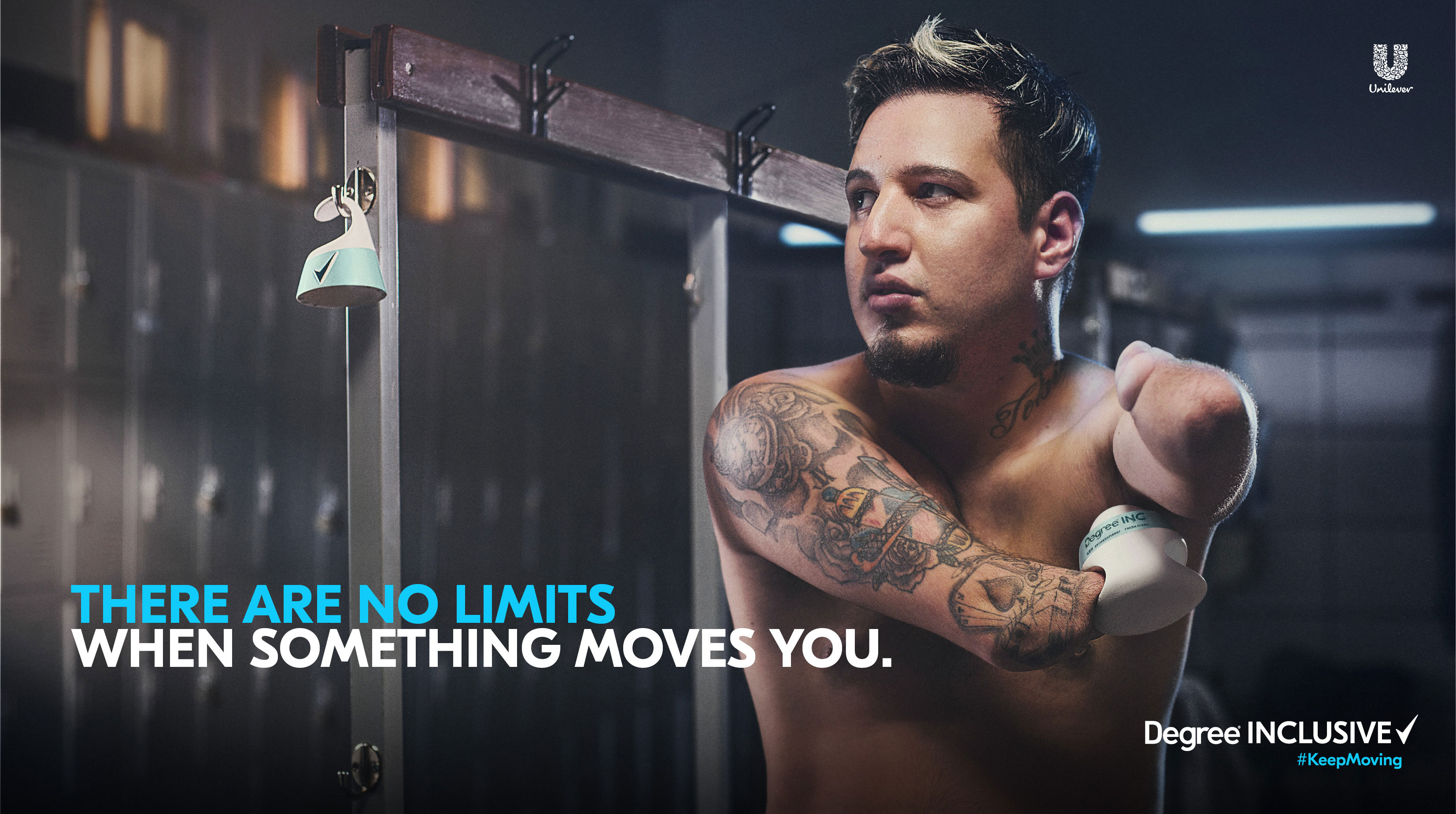 A man with limb difference in a locker room, standing next to the adaptive deodorant hanging on a rack with the slogan "There are no limits when something moves you."