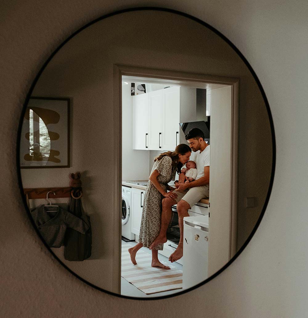 Parents embracing their child in a cozy home, reflecting the peace of mind that comes with strong insurance protection.