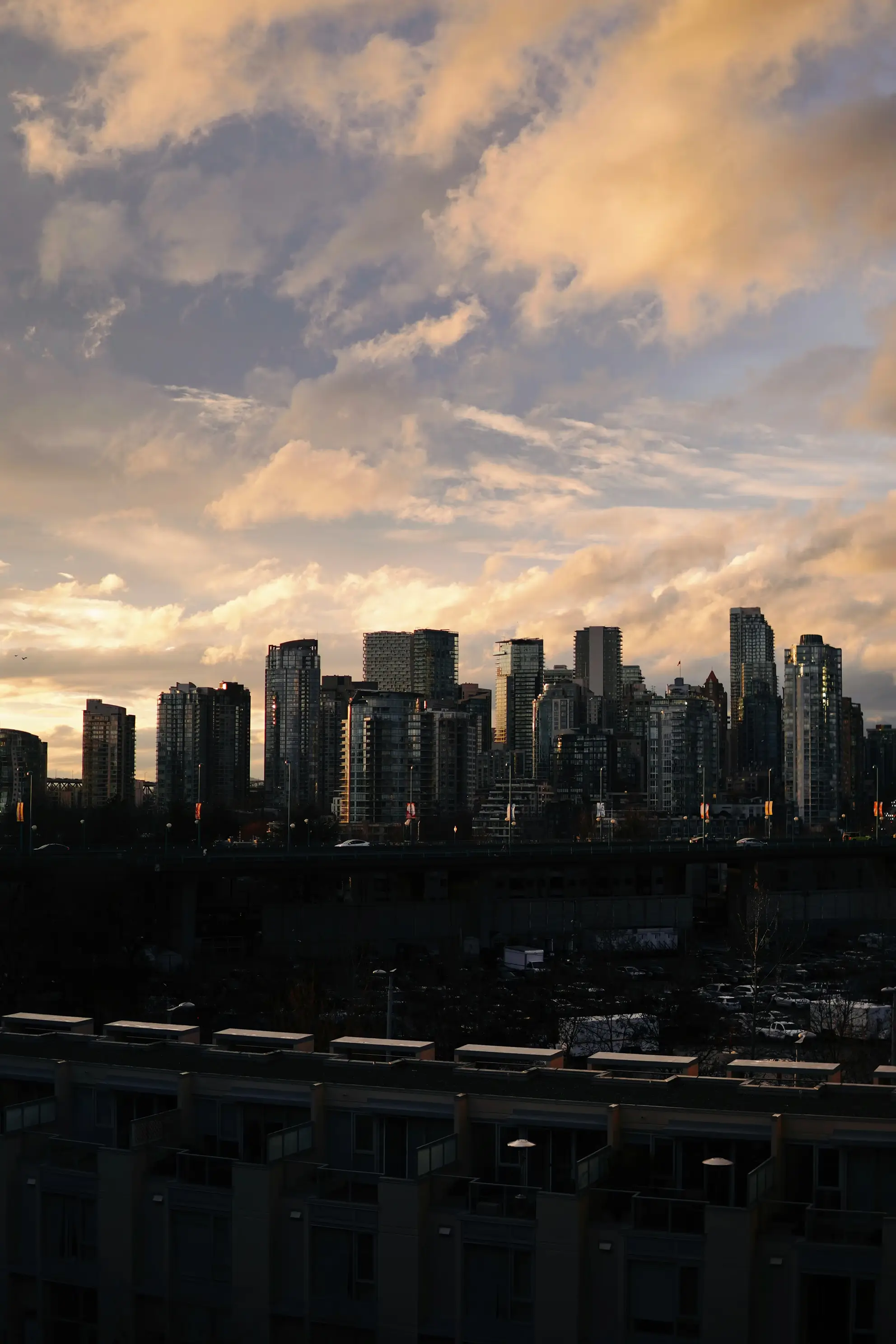 City skyline at dusk with modern buildings – financial planning services in Canada