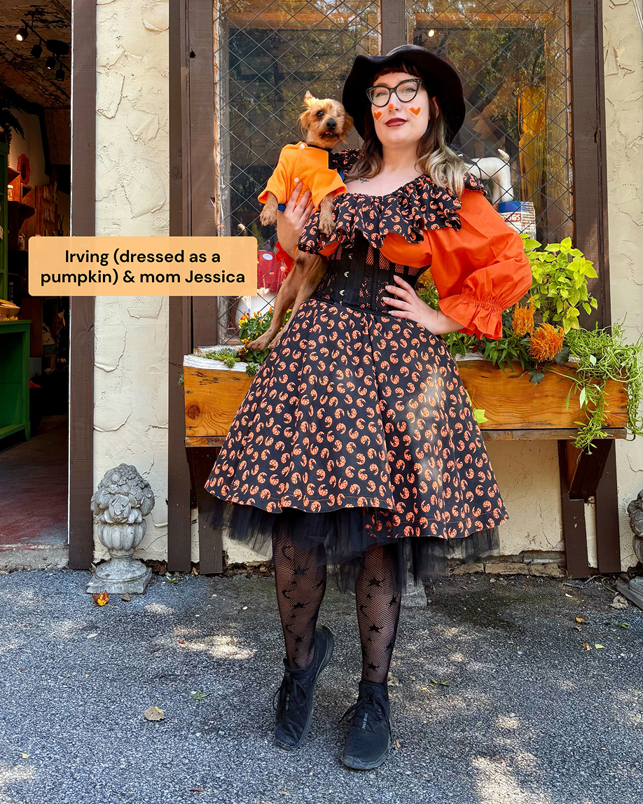 A woman and her small dog in matching Halloween costumes.