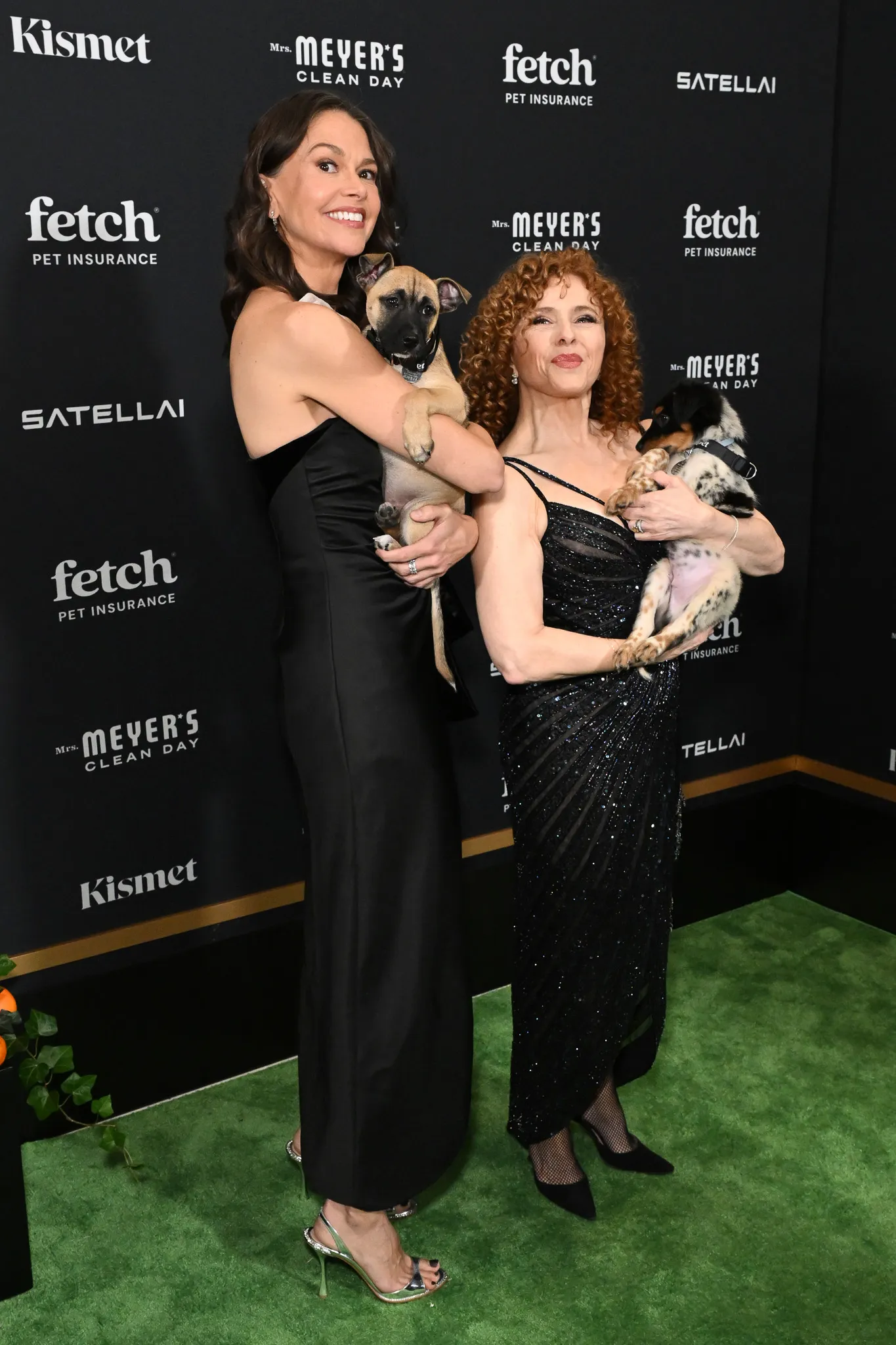 Sutton Foster and Bernadette Peters pose with Rescue Pups from North Shore Animal League America.