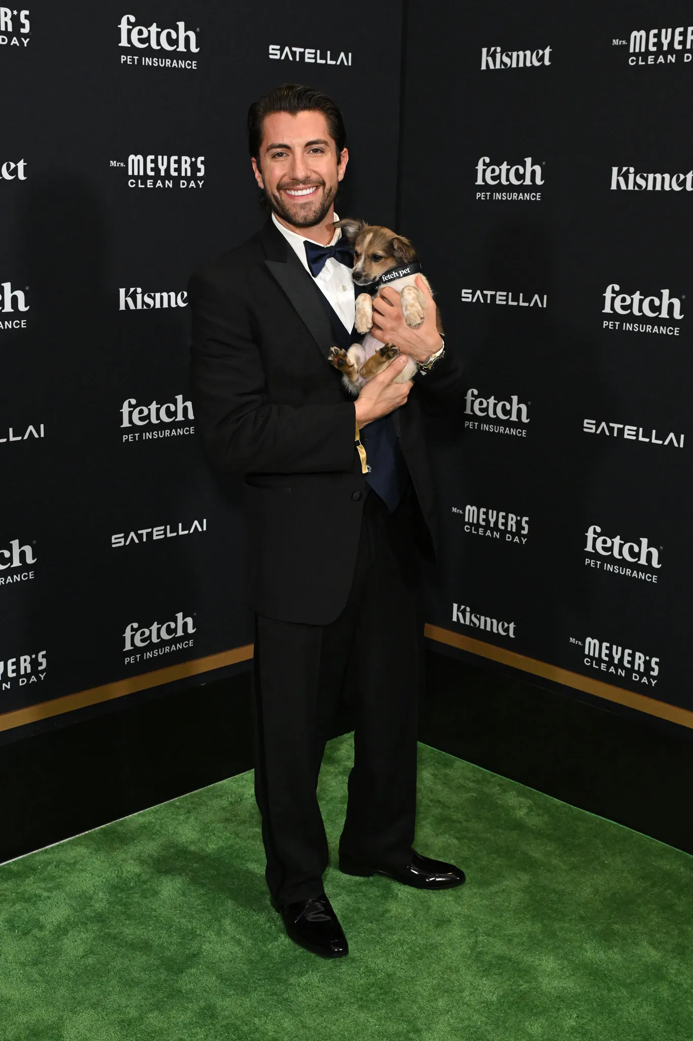 Jason Tartick poses with Rescue Pup from North Shore Animal League America at the 2025 Fetch Pet Gala.