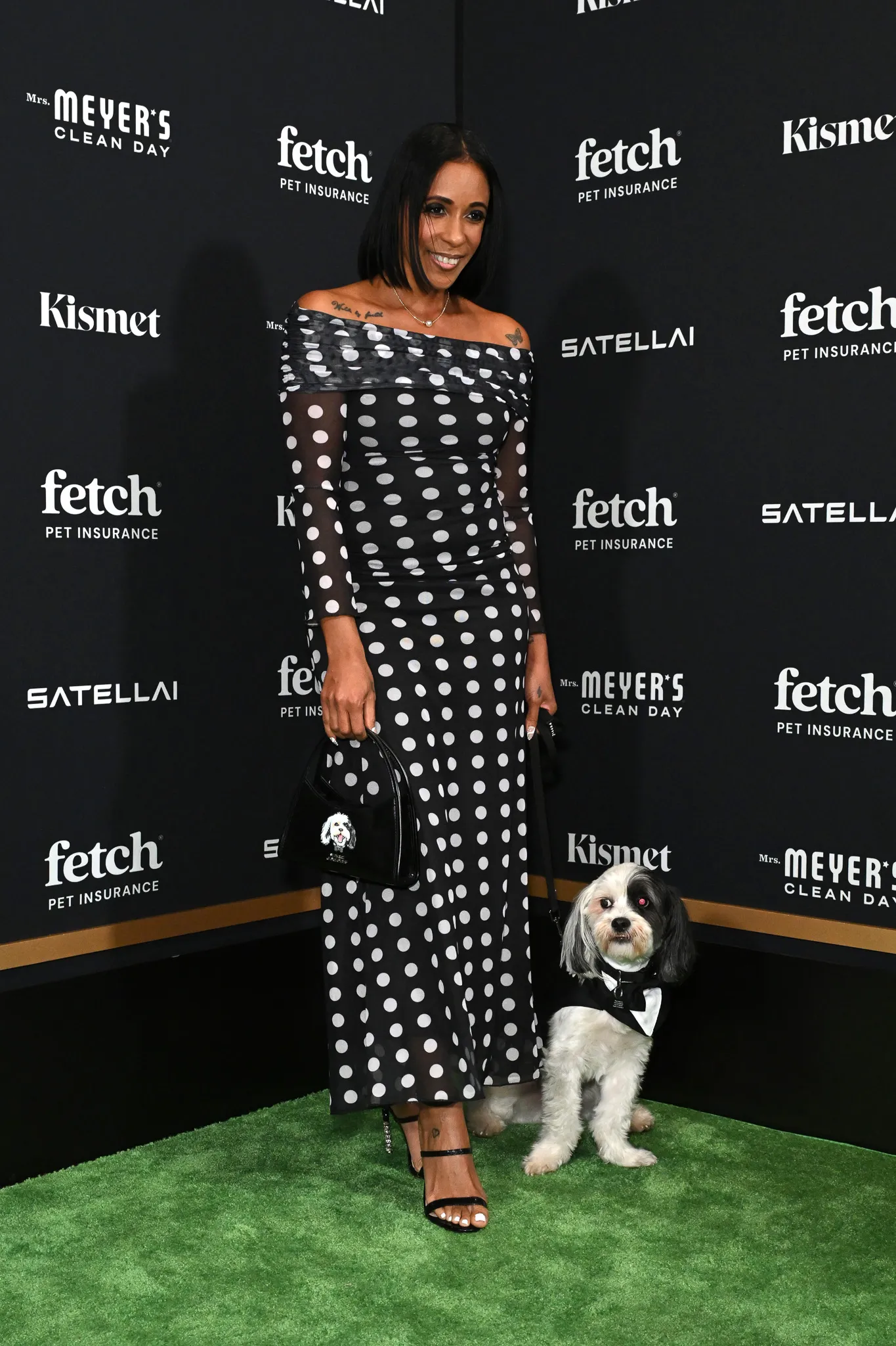 Martha Luna poses with Rescue Pup from North Shore Animal League America.