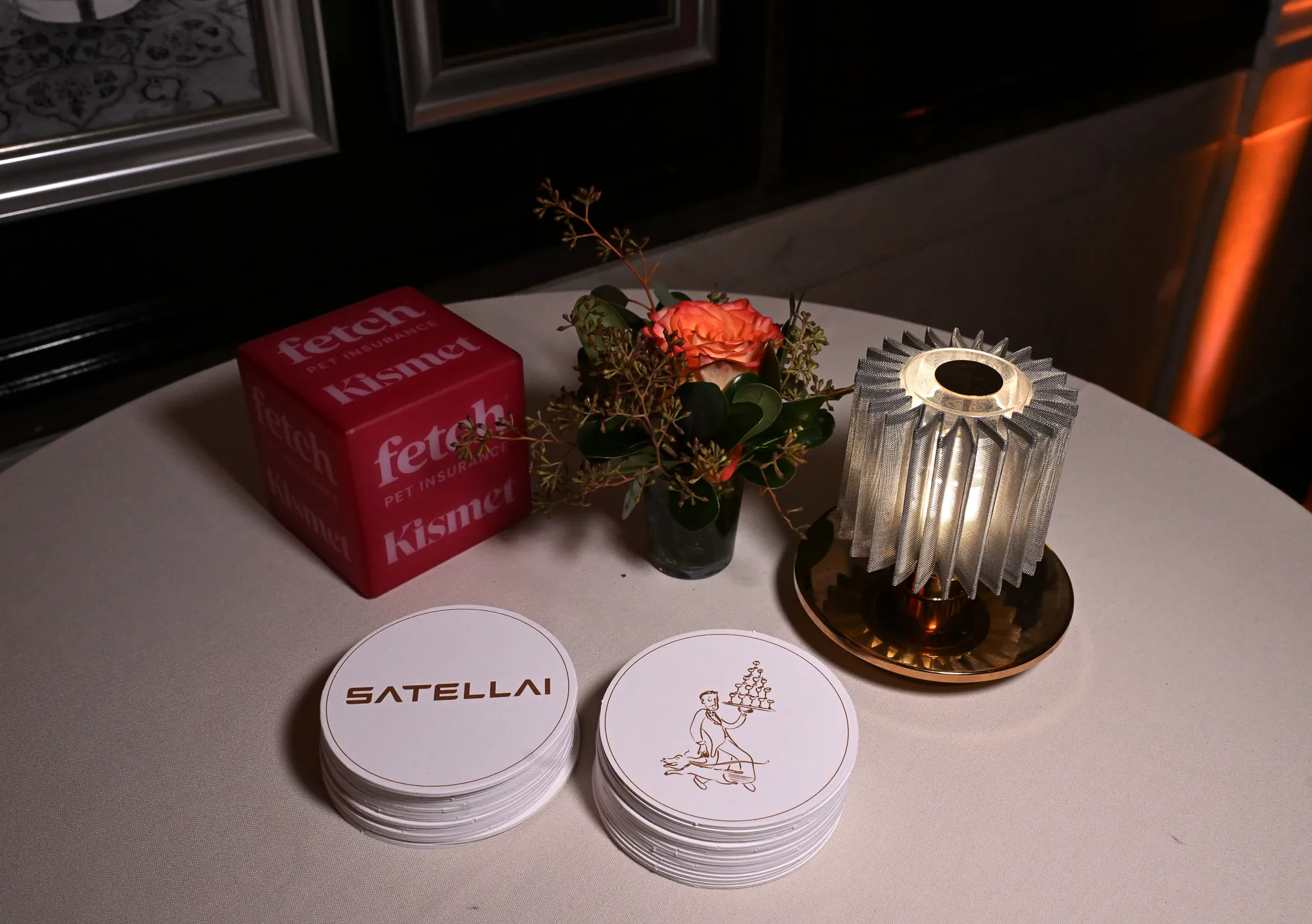 SATELLAI-branded coasters celebrating the Fetch and SATELLAI partnership at the Fetch Pet Gala.