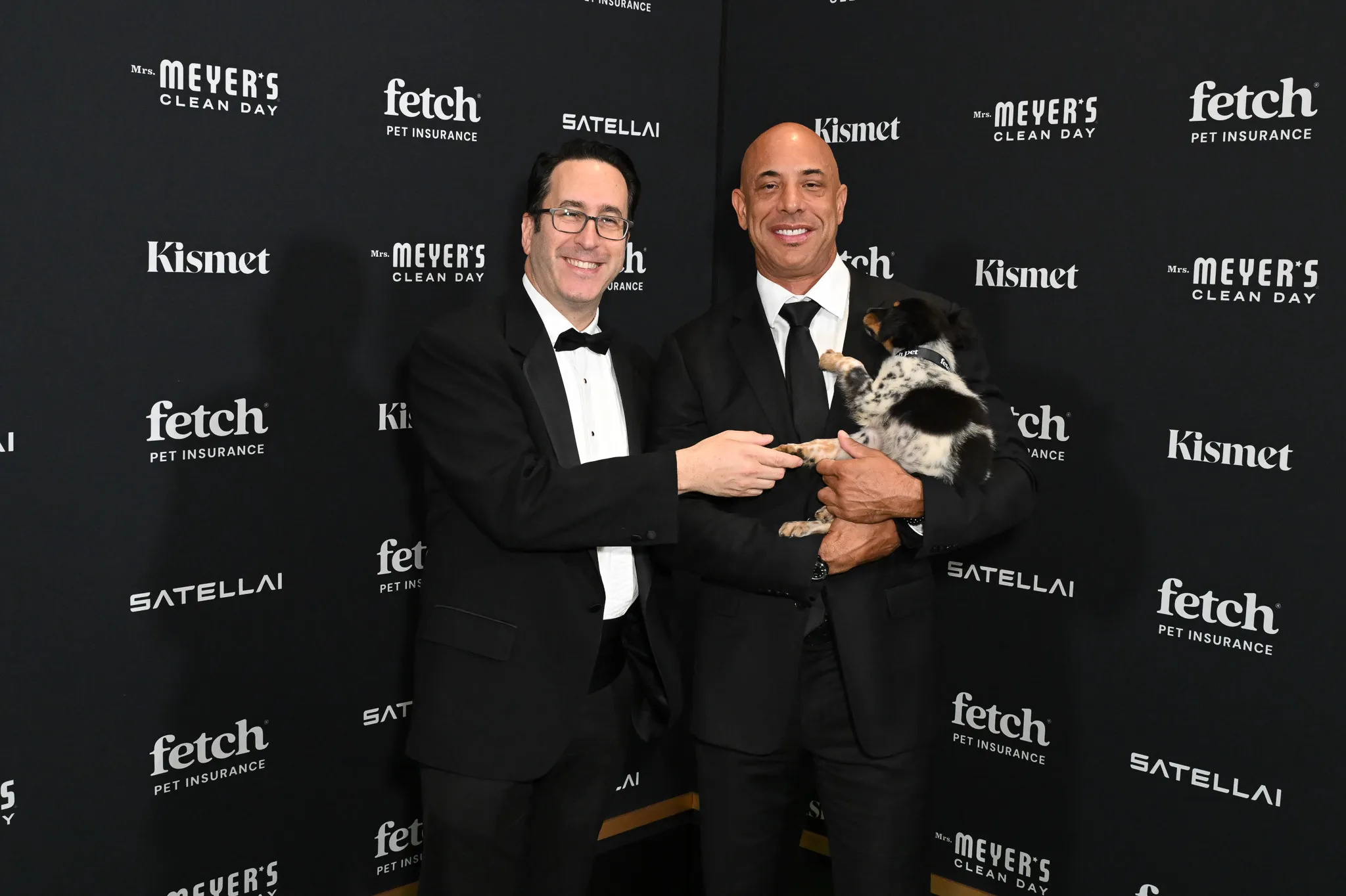 Dr. Kwane, Project Street Vet founder, poses with rescue pup from North Shore Animal League America at the 2025 Fetch Pet Gala.